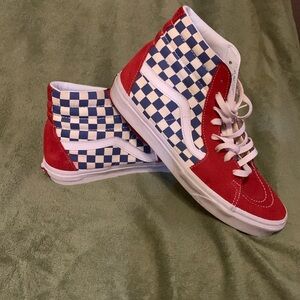 Red, white, & blue vans lace skate shoes. Toe and heel made out of suede